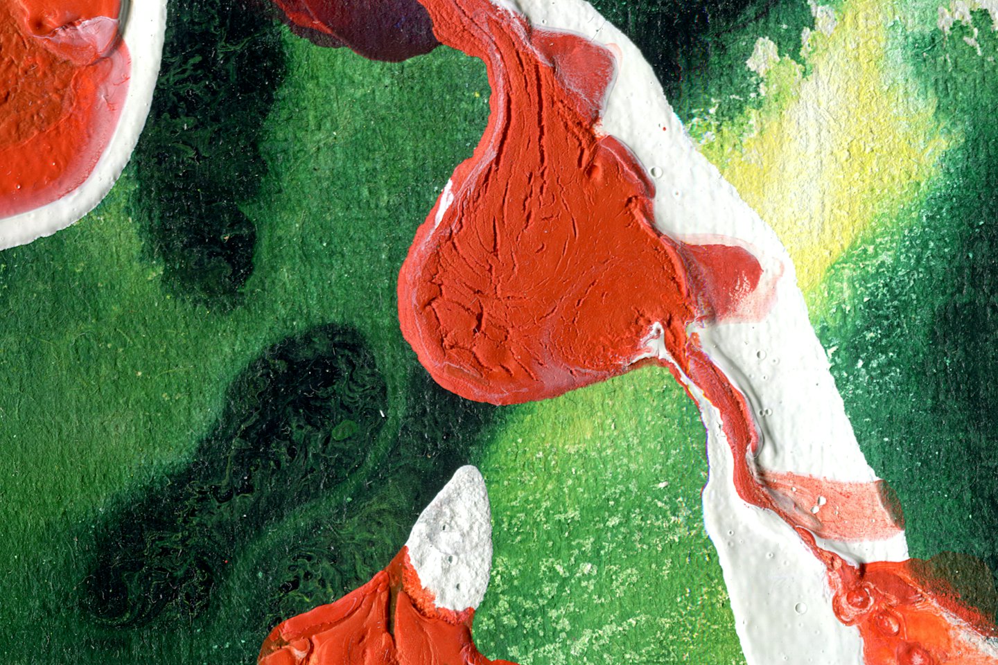 Textured red orange and white paint flows over green canvas.
